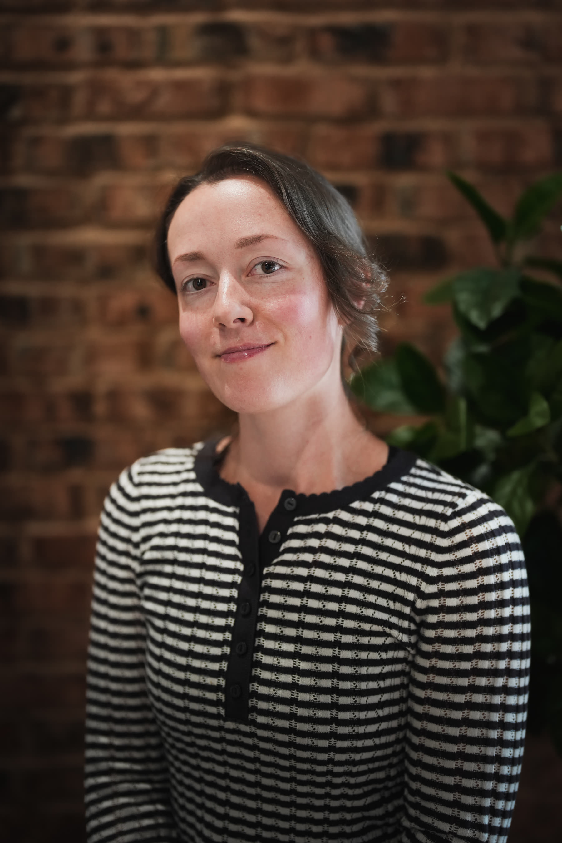 Professional headshot, natural expression